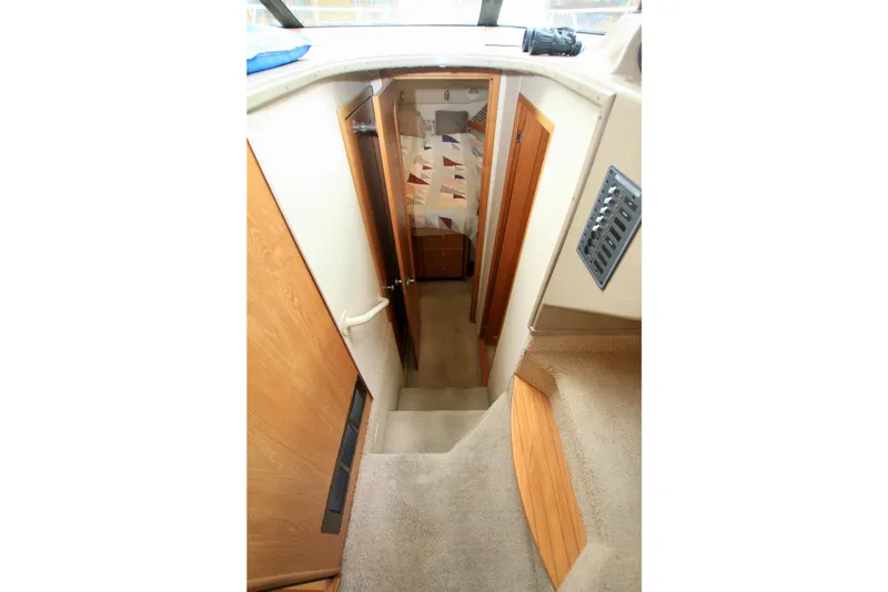 Slide: The Image of 1998 Bayliner 3788 Command Bridge Motoryacht helm with navigation equipment and controls. - 45
