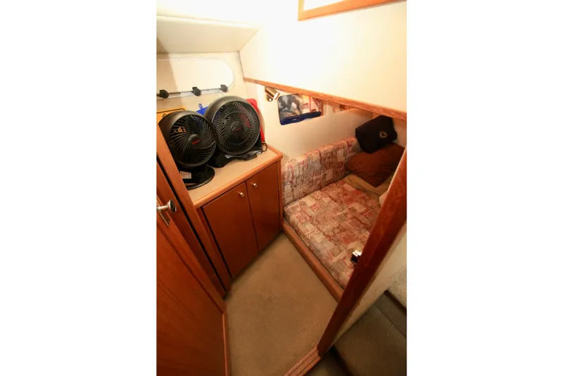 Slide: The Image of 1998 Bayliner 3788 Command Bridge Motoryacht helm with steering wheel and control panel. - 46