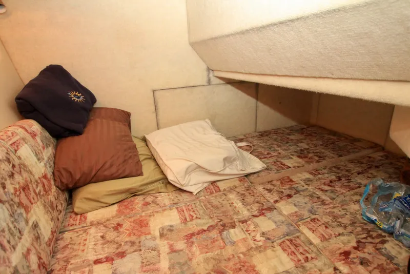 Slide: The Image of 1998 Bayliner 3788 Command Bridge Motoryacht helm with leather seating and control panel. - 47