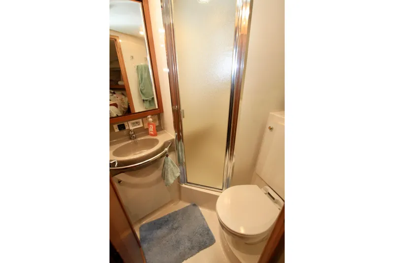 Slide: The Image of Bathroom of 1998 Bayliner 3788 Command Bridge Motoryacht with shower, sink, and toilet. - 54