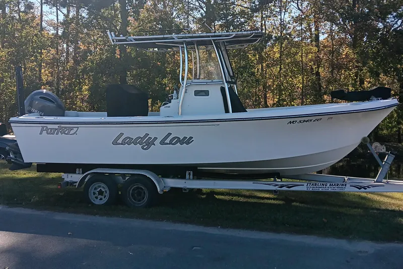 Slide: The Image of 2016 Parker 2300 Special Edition boat on trailer, side view, outdoors. - 2