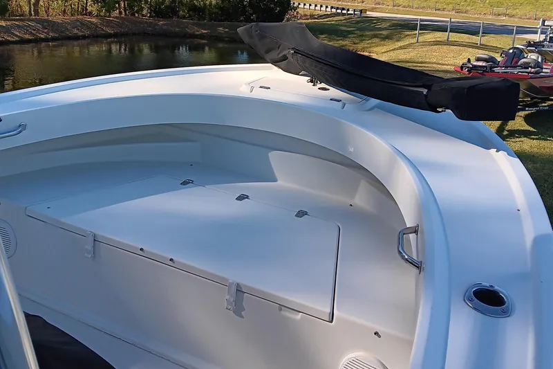 Slide: The Image of 2016 Parker 2300 Special Edition boat interior with seating and storage. - 8