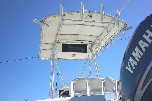 Slide: The Image of 2004 Grady-White Fisherman 209 boat with Yamaha engine, viewed from below against blue sky. - 11