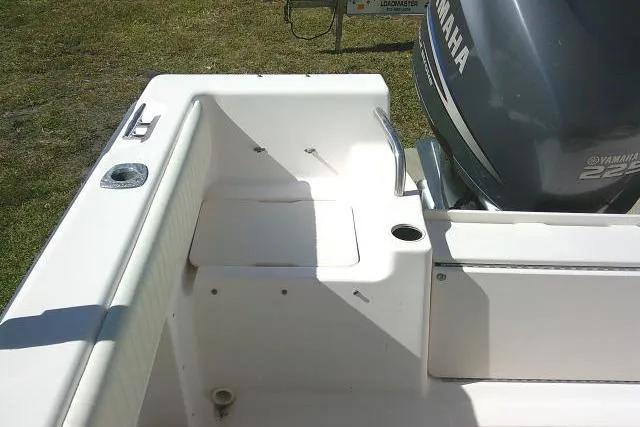 Slide: The Image of 2004 Grady-White Fisherman 209 boat with Yamaha engine, featuring a clean deck layout. - 13