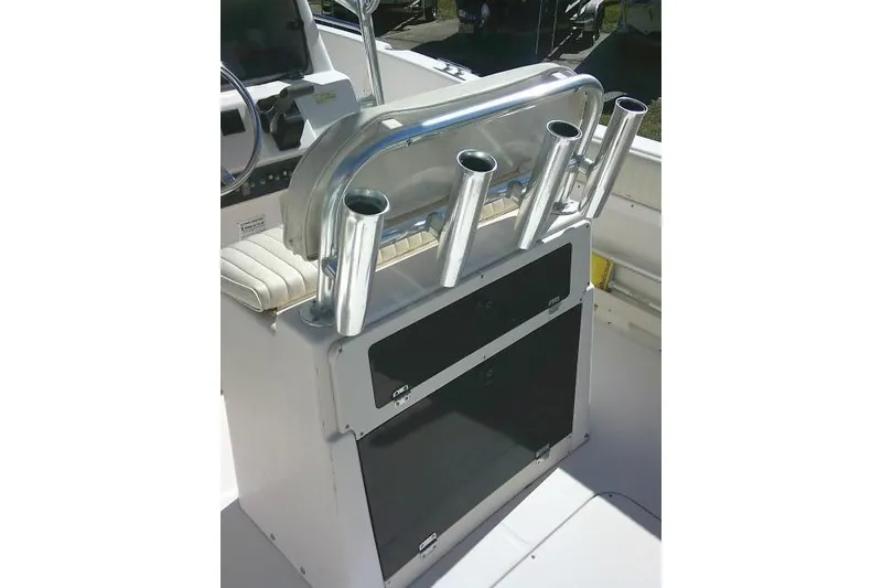 Slide: The Image of 2004 Grady-White Fisherman 209 boat console with rod holders and steering wheel. - 18