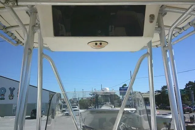 Slide: The Image of 2004 Grady-White Fisherman 209 boat with T-top and clear skies in the background. - 20