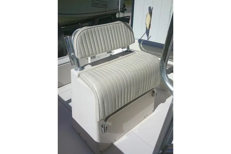 Slide: The Image of 2004 Grady-White Fisherman 209 boat seat with striped upholstery and chrome accents. - 21