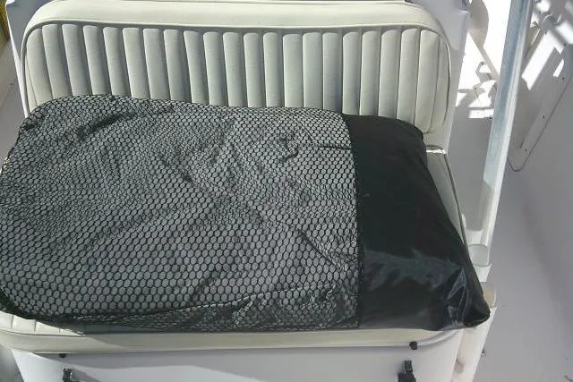 Slide: The Image of 2004 Grady-White Fisherman 209 boat seat with black mesh cover. - 24