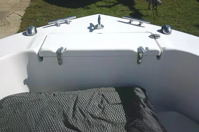 Slide: The Image of 2004 Grady-White Fisherman 209 boat bow with storage compartment and cleats. - 25