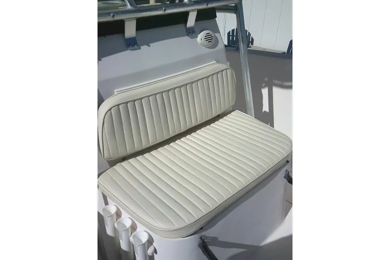Slide: The Image of 2004 Grady-White Fisherman 209 boat seat with white cushioned upholstery. - 26