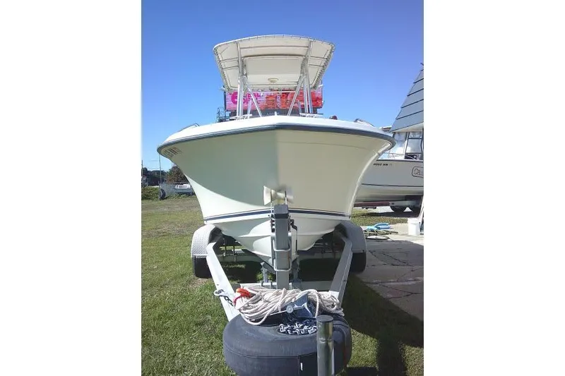 Slide: The Image of 2004 Grady-White Fisherman 209 boat on trailer, parked on grass. - 3