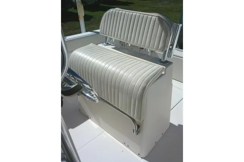 Slide: The Image of 2004 Grady-White Fisherman 209 boat seat with white cushioned upholstery. - 31