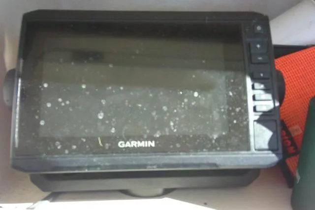 Slide: The Image of Garmin GPS device on 2004 Grady-White Fisherman 209 boat dashboard. - 32