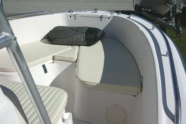Slide: The Image of 2004 Grady-White Fisherman 209 boat interior with cushioned seating and storage. - 33