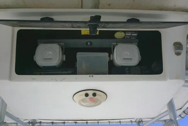 Slide: The Image of 2004 Grady-White Fisherman 209 boat console with speakers and light fixture. - 34