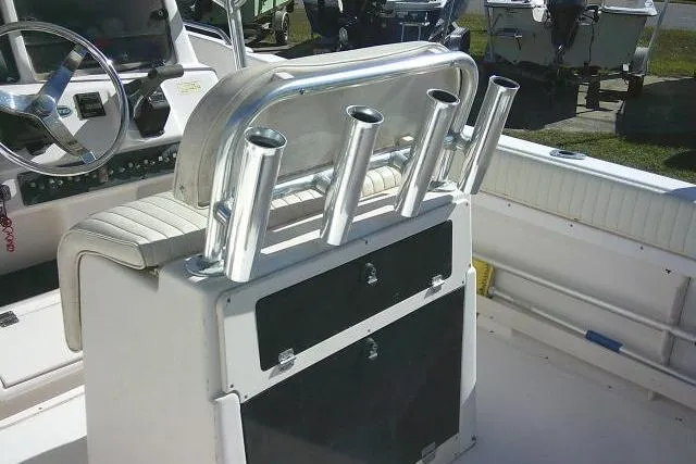 Slide: The Image of 2004 Grady-White Fisherman 209 boat interior with rod holders and steering wheel. - 36