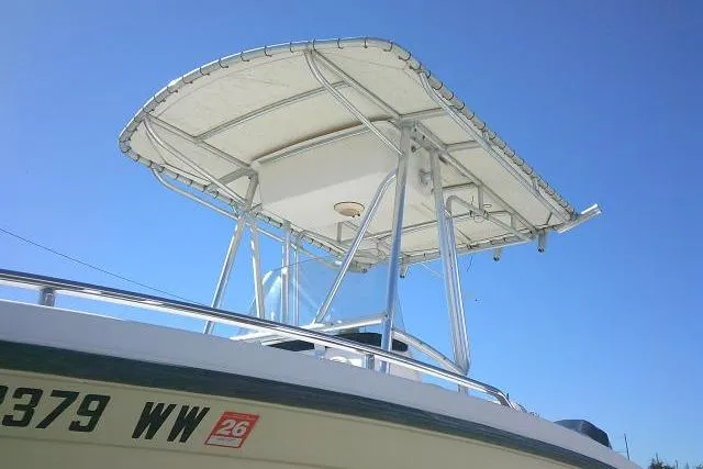Slide: The Image of 2004 Grady-White Fisherman 209 boat with T-top against clear blue sky. - 6