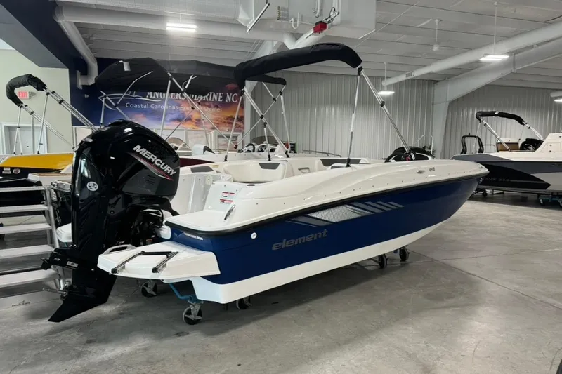 Slide: The Image of 2025 Bayliner Element E18 boat with Mercury engine in showroom. - 2