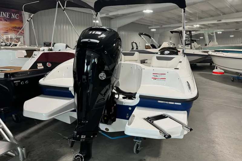 Slide: The Image of 2025 Bayliner Element E18 boat with Mercury 115 engine in showroom. - 4