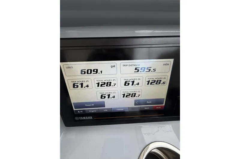 Slide: The Image of Yamaha display showing fuel usage and trip data on 2022 Pursuit DC 365 Dual Console. - 16
