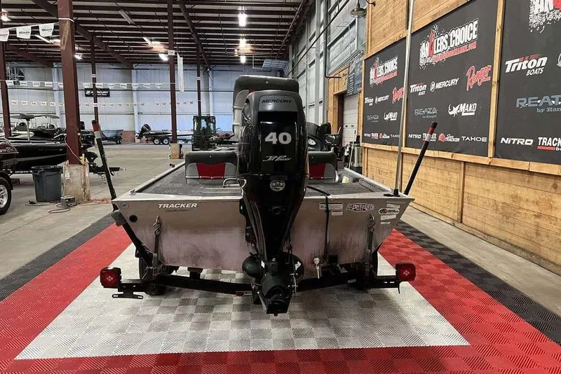 Slide: The Image of 2014 Tracker Pro 170 boat with Mercury 40 engine in showroom. - 2