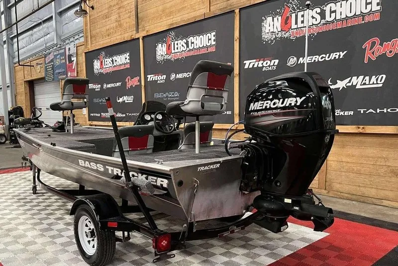 Slide: The Image of 2014 Tracker Pro 170 bass boat with Mercury engine on display at Angler's Choice showroom. - 8