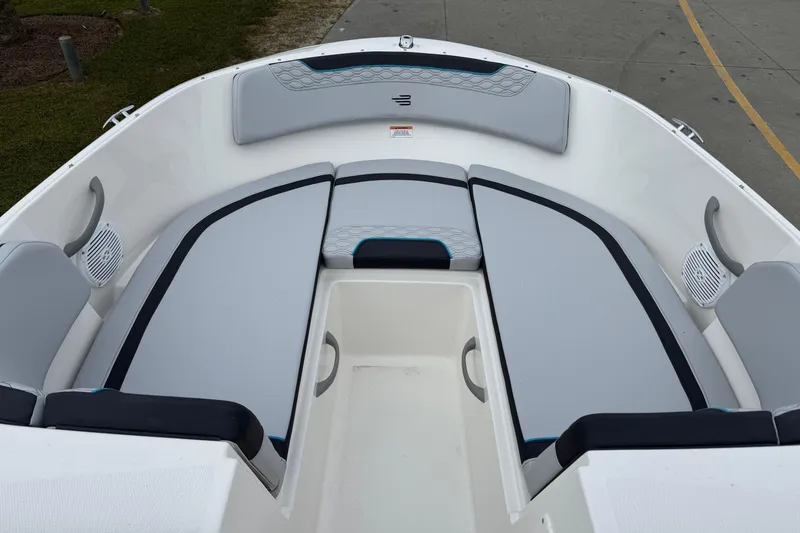 Slide: The Image of 2026 Bayliner M19 boat interior with cushioned seating and modern design. - 10
