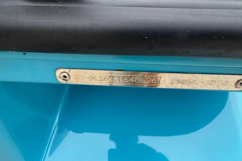 Slide: The Image of Bayliner M19 2026 boat identification plate on a blue hull. - 5