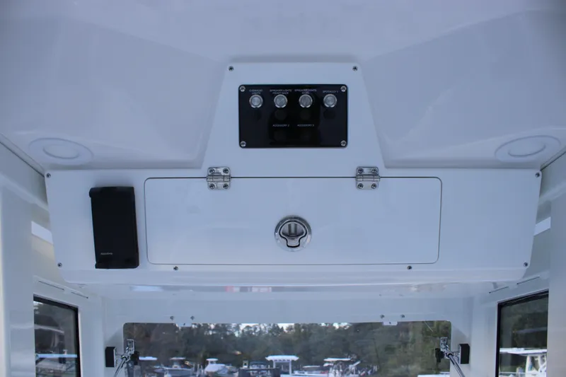 Slide: The Image of 2026 Sea Fox 268 Commander boat console with control panel and storage compartment. - 11