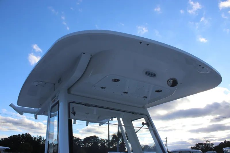 Slide: The Image of 2026 Sea Fox 268 Commander boat top against a blue sky. - 12