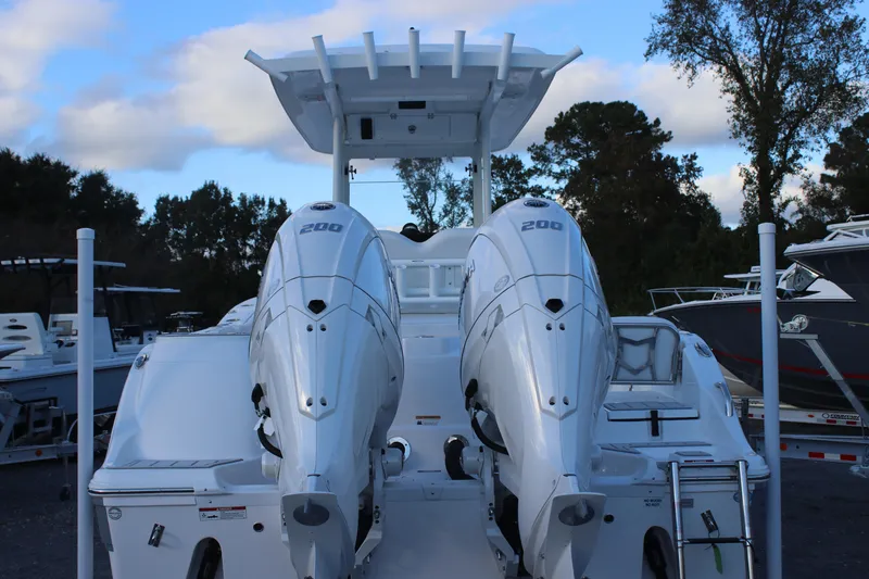 Slide: The Image of 2026 Sea Fox 268 Commander with dual 200 horsepower engines, docked outdoors. - 3