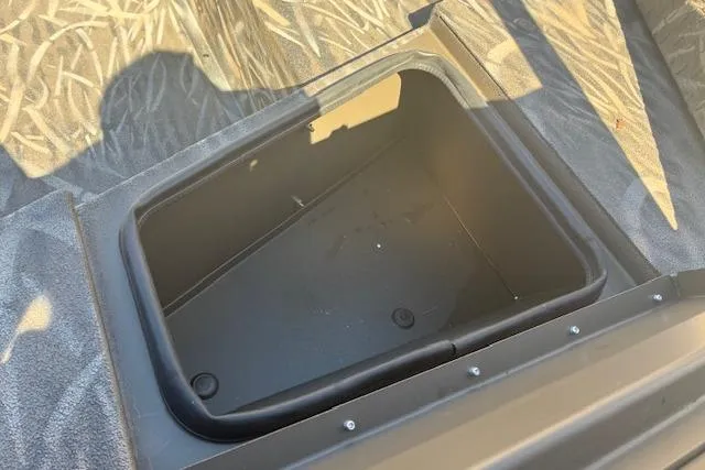 Slide: The Image of 2025 G3 1652 CC boat interior with control panel and cup holder. - 4