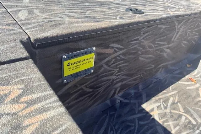 Slide: The Image of 2025 G3 1652 CC boat with camo pattern and outboard motor. - 6