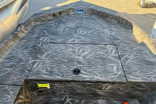 Slide: The Image of 2025 G3 1652 CC boat deck with camouflage pattern and storage compartment. - 8