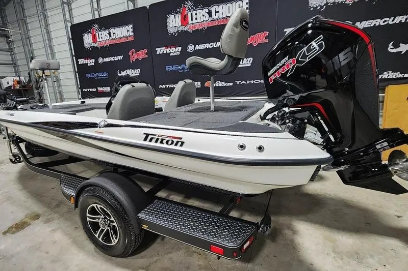 Slide: The Image of 2026 Triton 179 TrX boat in showroom, featuring Mercury Pro XS engine. - 2