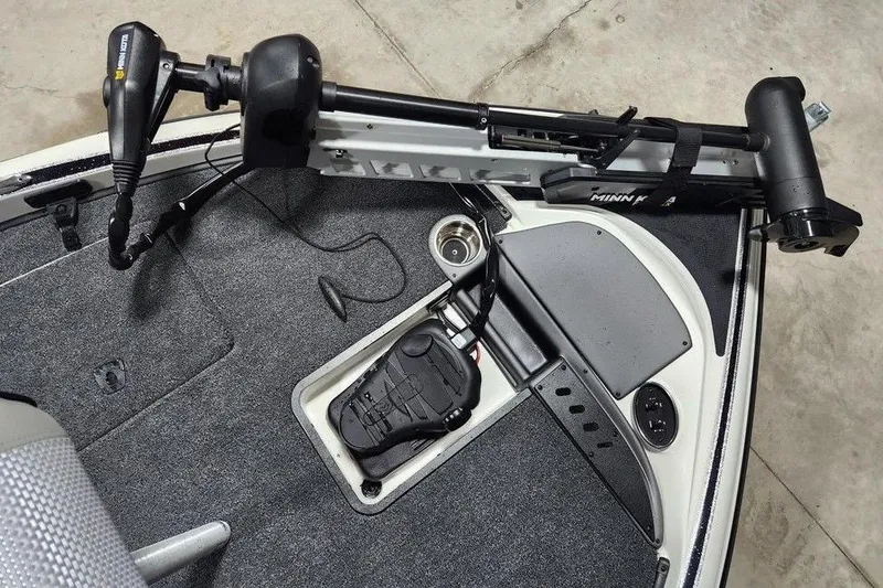 Slide: The Image of 2026 Triton 179 TrX boat deck with Minn Kota trolling motor and foot pedal. - 3