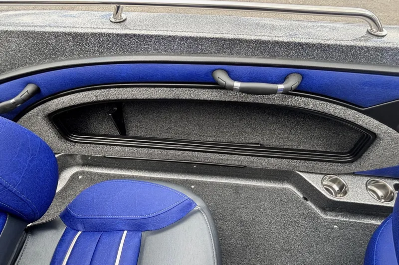 Slide: The Image of 2026 Ranger 1880MS A Pack boat interior with blue seating and storage compartment. - 11