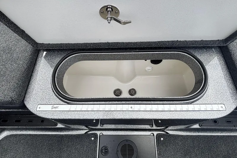 Slide: The Image of 2026 Ranger 1880MS A Pack Equipped boat livewell with measuring ruler. - 12