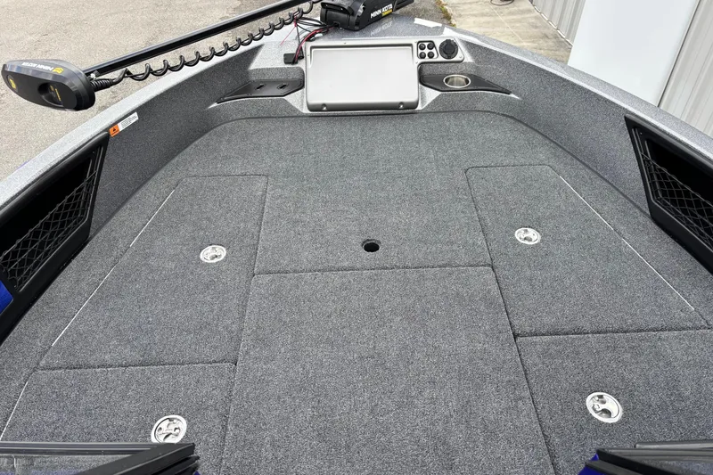 Slide: The Image of 2026 Ranger 1880MS A Pack Equipped boat deck with storage compartments and trolling motor. - 3