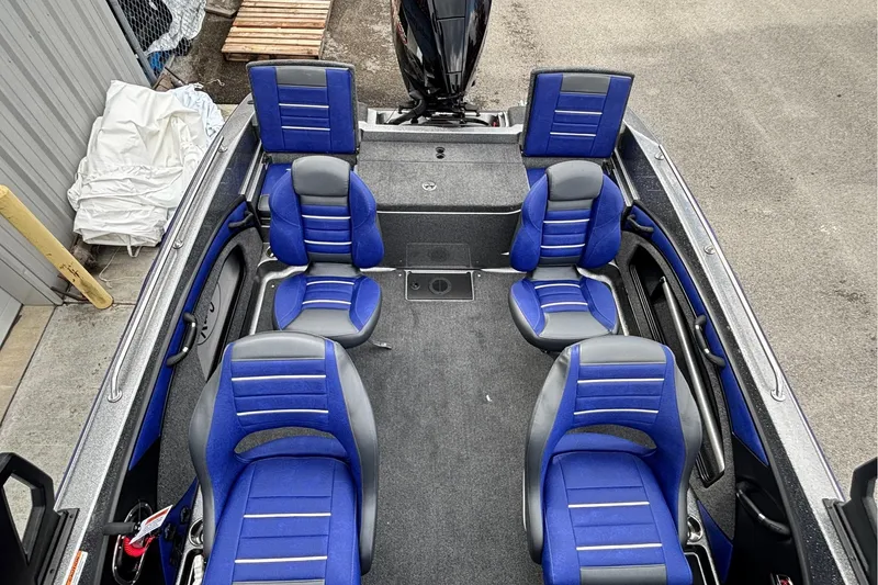 Slide: The Image of 2026 Ranger 1880MS A Pack boat interior with blue and gray seating arrangement. - 8