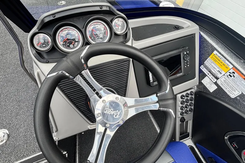 Slide: The Image of 2026 Ranger 1880MS A Pack Equipped boat dashboard with steering wheel and control panel. - 9