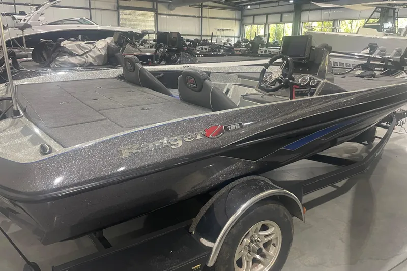 Slide: The Image of 2019 Ranger Z185 boat in showroom, featuring sleek design and modern equipment. - 4