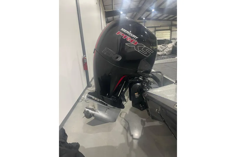 Slide: The Image of 2019 Ranger Z185 boat with Mercury Pro XS 150 outboard motor in a garage. - 9