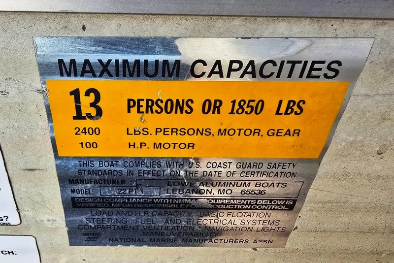 Slide: The Image of Capacity label for 1999 Lowe Trinidad 220 boat, max 13 people or 1850 lbs. - 10
