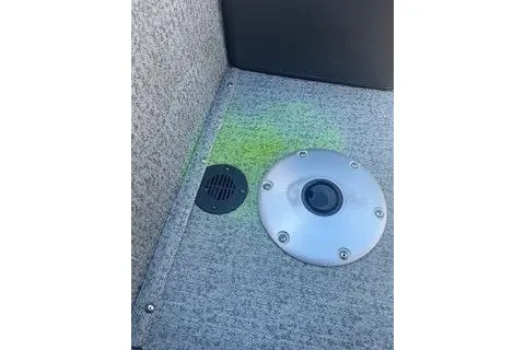 Slide: The Image of 2022 Tracker Pro Team 175 TF boat interior with carpeted floor and circular fixture. - 8