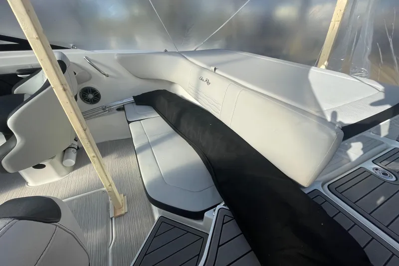 Slide: The Image of Interior of a 2022 Sea Ray SPX 190 boat with white seating and modern design. - 7