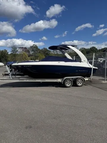 The Image of 2022 Regal 2000 ES boat on trailer under blue sky with clouds. - 1
