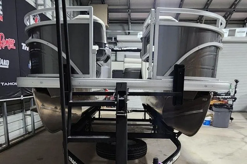 Slide: The Image of 2026 Sun Tracker Fishin' Barge 20 DLX pontoon boat side view. - 11