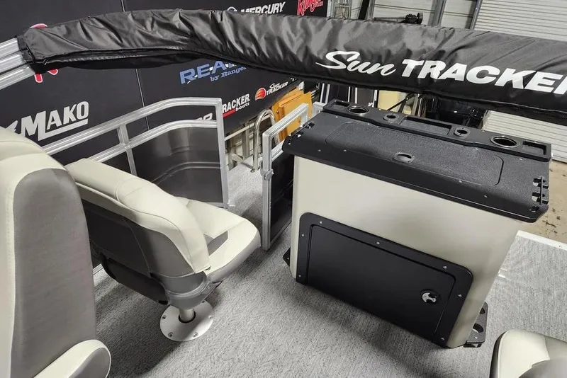 Slide: The Image of 2026 Sun Tracker Fishin' Barge 20 DLX interior with comfortable seating and modern design. - 13