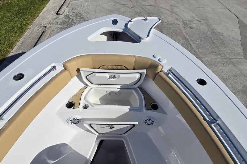 Slide: The Image of 2022 Sportsman Open 282TE Center Console boat interior with storage compartments open. - 19